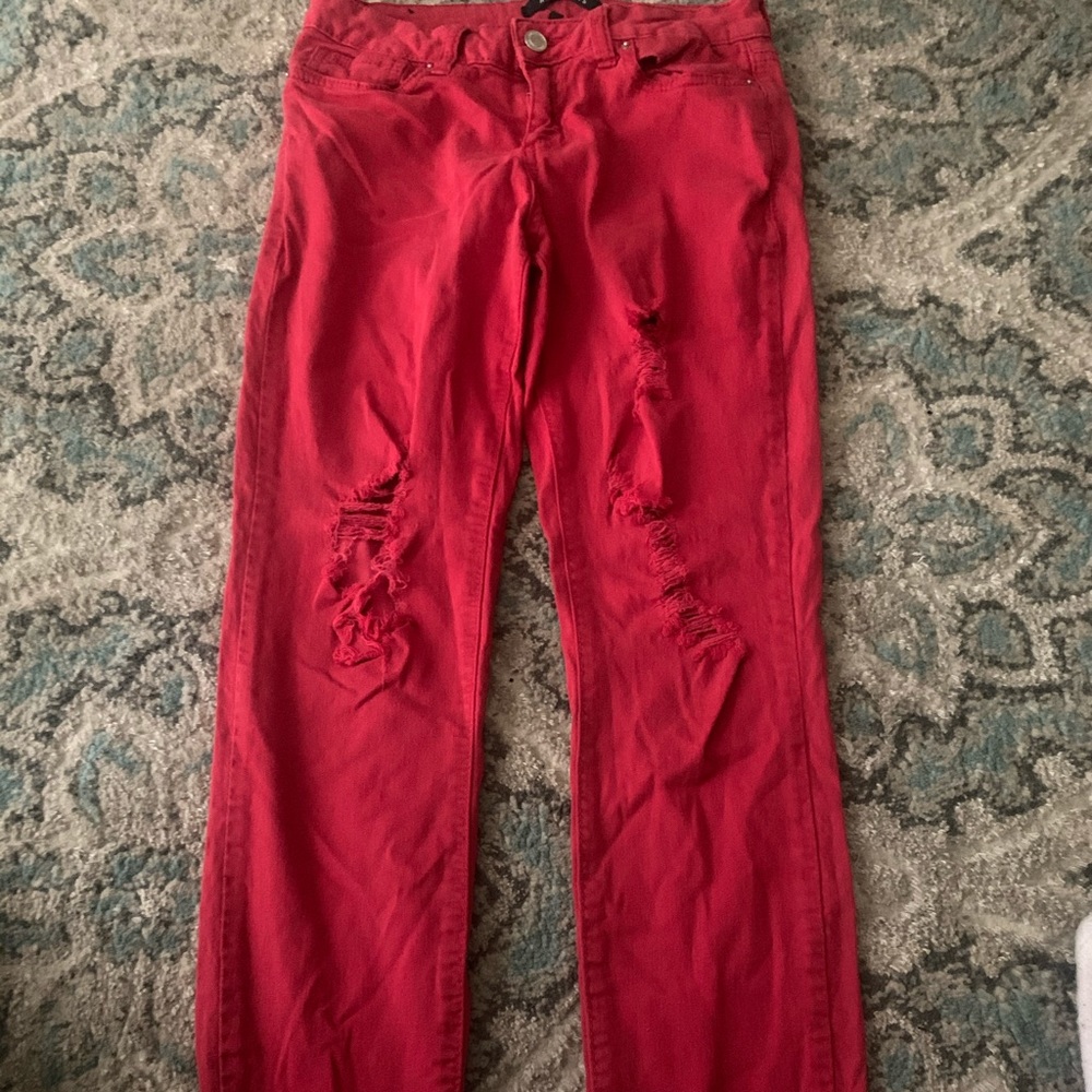 Red ripped jeans.